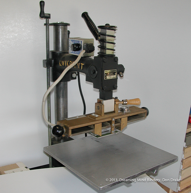 A Kwikprint 86 foil stamping machine