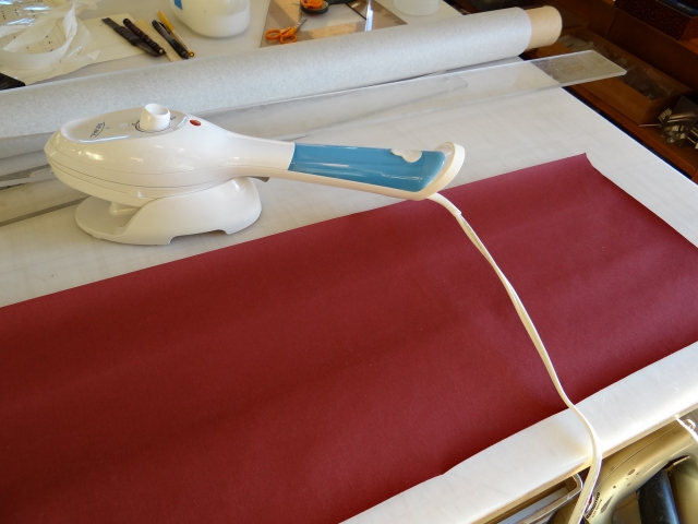 Using a steamer to take the curl out of book cloth