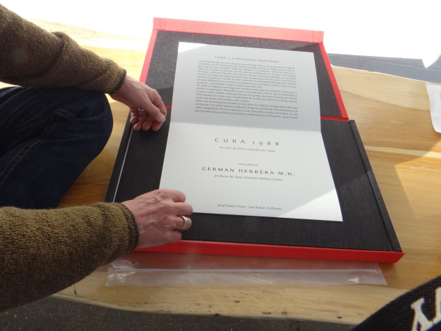 Germán Herrera showing his recently completed 'Cuba 1988 portfolio at the 2013 Codex in the Craneway Pavillion, Richmond, CA