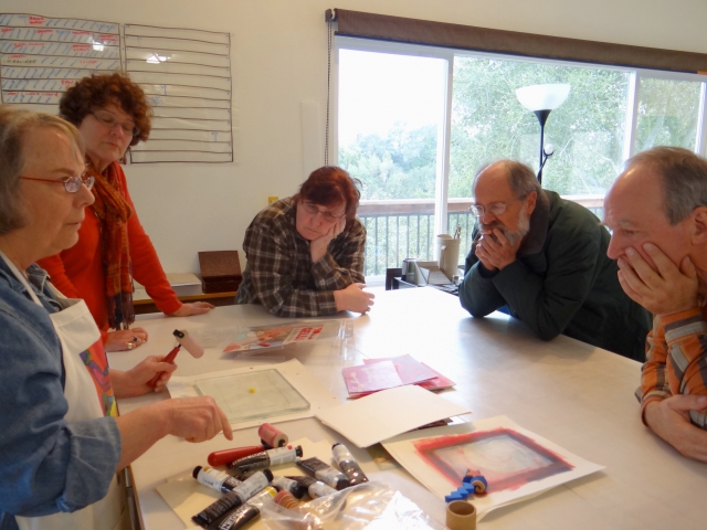 Judith Hoffman prepares to demonstrate Gel Printing to fellow BA members Rae Trujillo, Ginger Burrell, Jim Stewart and Don Drake