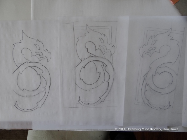 Preliminary sketches of a dragon design to be used in a copper journal cover.