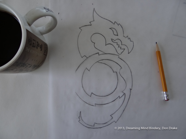 The final sketch for a dragon design to be turned into a copper journal cover.
