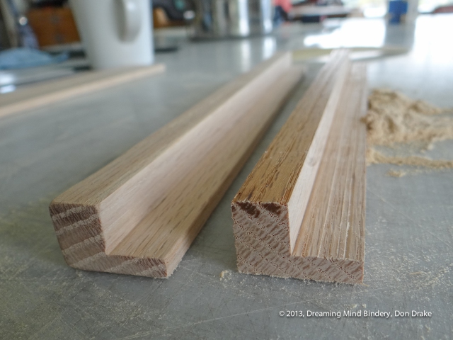 Sanding the oak rails that will support and suspend the Jaco Products coin holder and protect it from scratches.