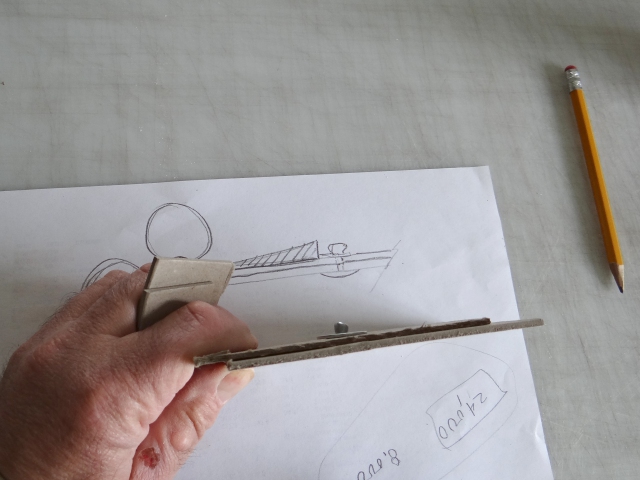 A diagram showing a possibly plan for minimizing the risk of material damage from the extension of pop rivets in a roll material storage system