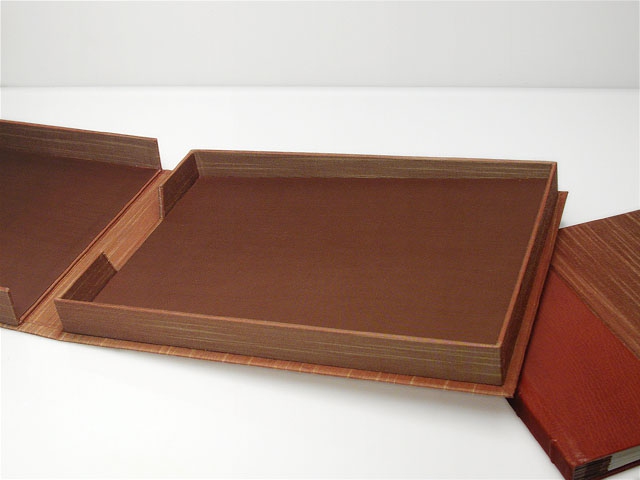 A quarter bound wedding album and matching clam shell box