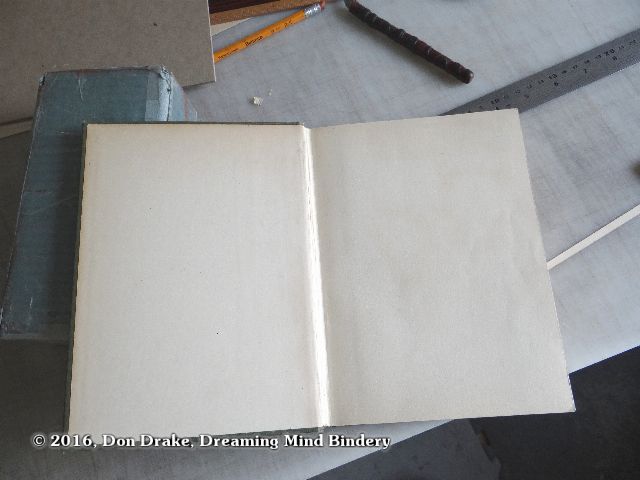 The replacement end papers in a restored book.