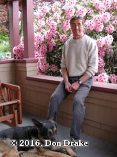 The late Hugh Stump sitting on his front porch in Oregon with a blooming rhododendron behind him